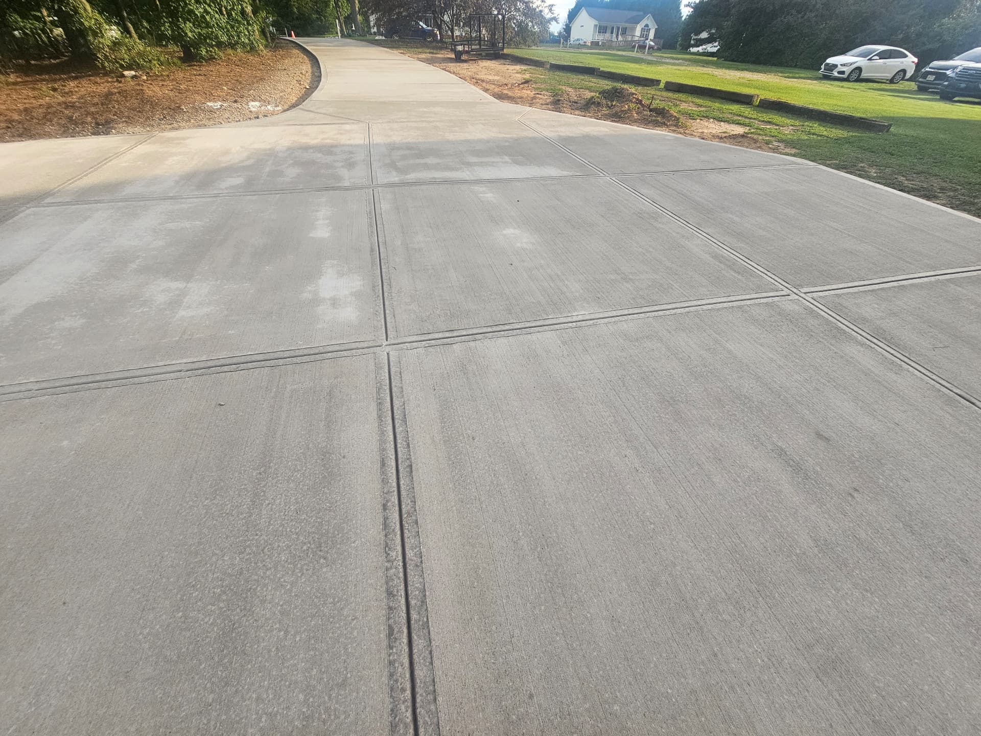 Wide concrete driveway with clean control joints